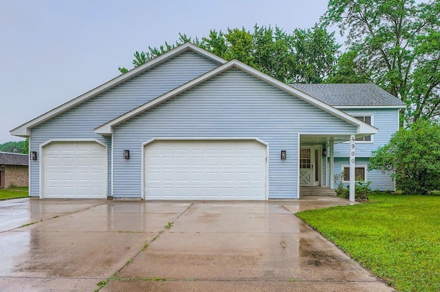 4900 Hodgson Rd, Connection, Shoreview, MN 55126 - view of front of home with concrete driveway, a garage, and a front lawn