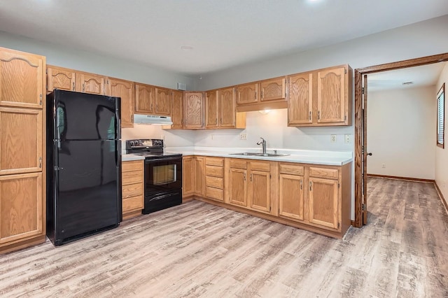 4900 Hodgson Rd, Connection, Shoreview, MN 55126 - kitchen featuring black appliances, under cabinet range hood, light countertops, and light wood-type flooring