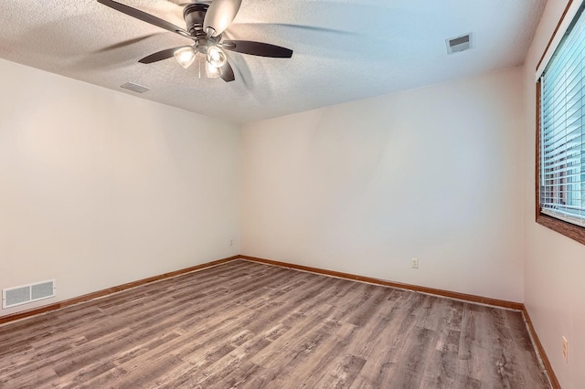 4900 Hodgson Rd, Connection, Shoreview, MN 55126 - empty room featuring wood finished floors, ceiling fan, and a textured ceiling