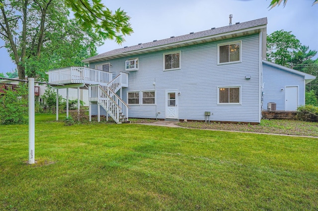 4900 Hodgson Rd, Connection, Shoreview, MN 55126 - rear view of property with stairs, a deck, and a yard