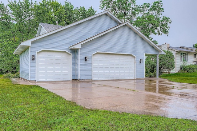 4900 Hodgson Rd, Connection, Shoreview, MN 55126 - view of front facade with concrete driveway, an attached garage, and a front yard