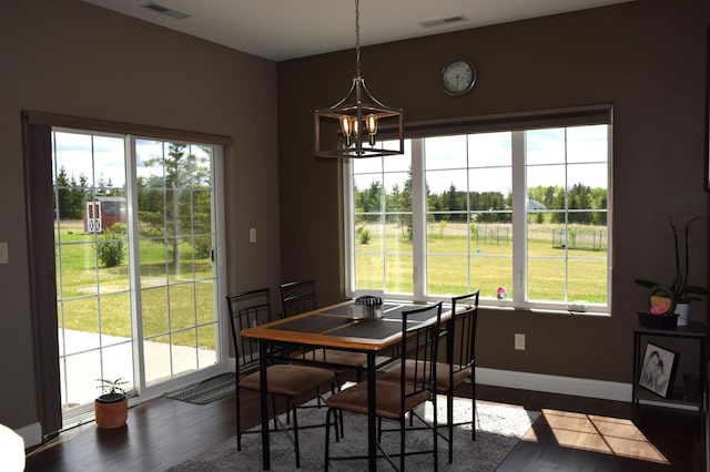 2008 Whiting Rd NW Unit 10, Bemidji, MN 56601 - dining room with a chandelier, dark wood-style flooring, and baseboards