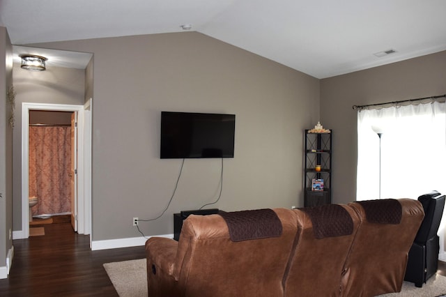 2008 Whiting Rd NW Unit 10, Bemidji, MN 56601 - living area with wood finished floors, baseboards, and lofted ceiling