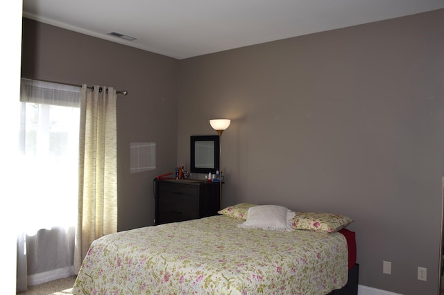2008 Whiting Rd NW Unit 10, Bemidji, MN 56601 - bedroom featuring baseboards and light carpet