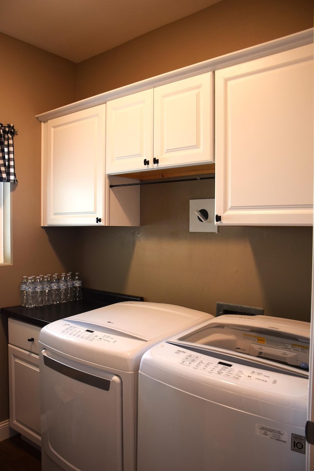2008 Whiting Rd NW Unit 10, Bemidji, MN 56601 - laundry area with cabinet space and independent washer and dryer