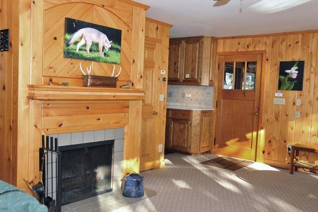 29626 436th Pl, Farm Island Twp, MN 56431 - unfurnished living room with ceiling fan, wooden walls, carpet, and a fireplace
