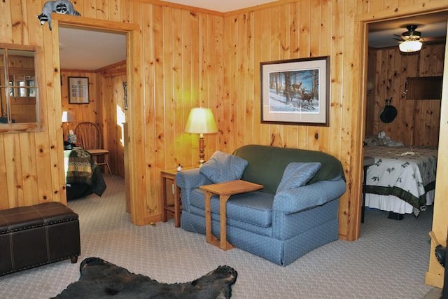 29626 436th Pl, Farm Island Twp, MN 56431 - living area with wood walls, carpet floors, and ceiling fan