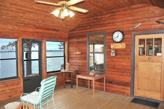 29626 436th Pl, Farm Island Twp, MN 56431 - sunroom with vaulted ceiling, wood-type flooring, a water view, and wooden walls