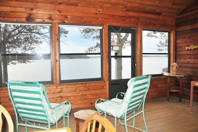 29626 436th Pl, Farm Island Twp, MN 56431 - sunroom with a water view, vaulted ceiling, hardwood / wood-style flooring, and wood walls