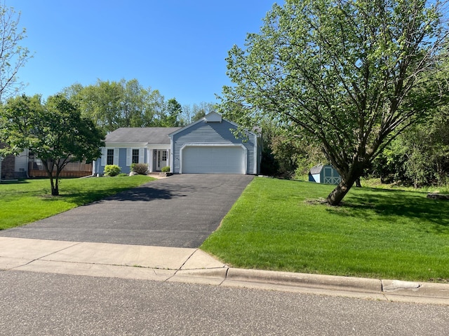 7765 Woodpark Blvd, Woodbury, MN 55125 - single story home featuring driveway, a front lawn, and a garage