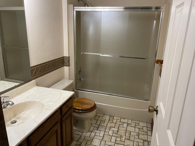 7765 Woodpark Blvd, Woodbury, MN 55125 - bathroom featuring vanity, toilet, and bath / shower combo with glass door