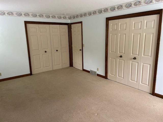 7765 Woodpark Blvd, Woodbury, MN 55125 - unfurnished bedroom with carpet and baseboards