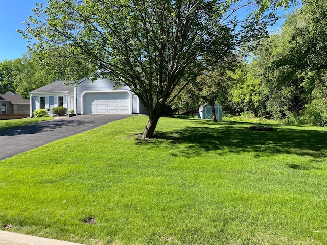 7765 Woodpark Blvd, Woodbury, MN 55125 - obstructed view of property featuring driveway, a front lawn, and a garage
