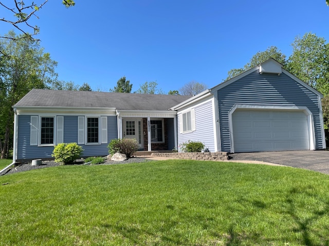 7765 Woodpark Blvd, Woodbury, MN 55125 - single story home featuring an attached garage, driveway, and a front yard