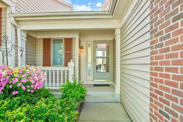 1439 Summit Shores Dr, Burnsville, MN 55306 - property entrance with a porch