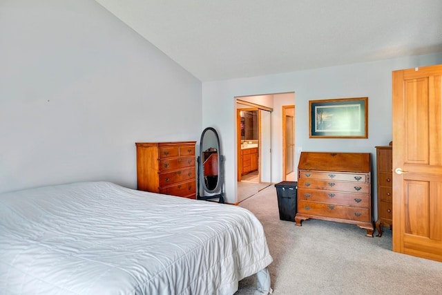 1439 Summit Shores Dr, Burnsville, MN 55306 - carpeted bedroom featuring vaulted ceiling and ensuite bathroom