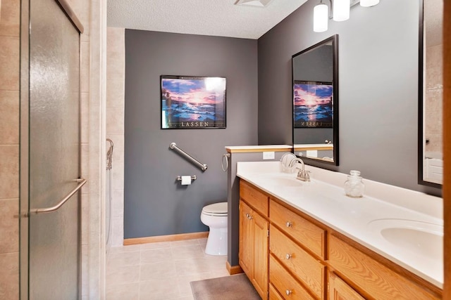 1439 Summit Shores Dr, Burnsville, MN 55306 - bathroom featuring double vanity, a shower stall, tile patterned flooring, and a textured ceiling
