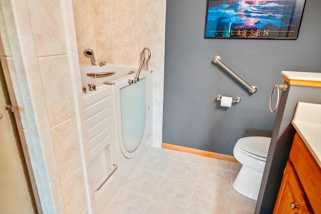 1439 Summit Shores Dr, Burnsville, MN 55306 - full bath featuring a tub to relax in, toilet, tile patterned floors, vanity, and baseboards