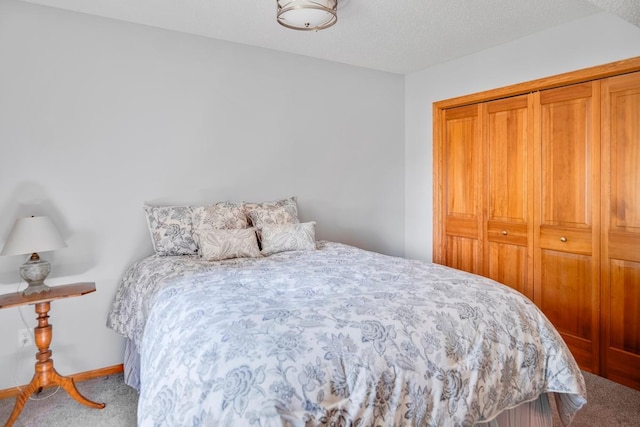1439 Summit Shores Dr, Burnsville, MN 55306 - carpeted bedroom featuring a closet and baseboards