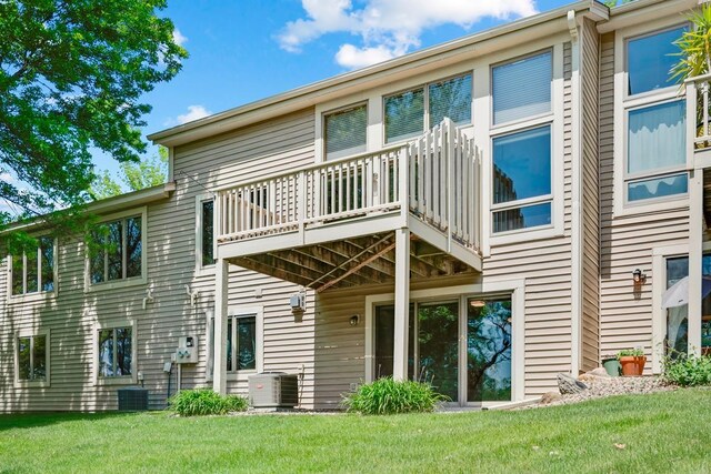 1439 Summit Shores Dr, Burnsville, MN 55306 - back of property with a balcony, cooling unit, and a yard