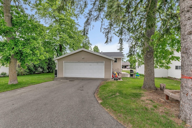 303 Park Ave SE, Pierz, MN 56364 - view of front of house featuring a front yard and a detached garage