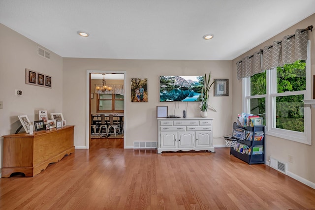 303 Park Ave SE, Pierz, MN 56364 - living area with a chandelier, light wood finished floors, baseboards, and recessed lighting