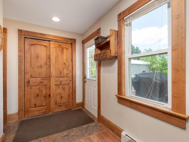 306 Benton St W, Cologne, MN 55322 - doorway with a baseboard heating unit, baseboards, and recessed lighting