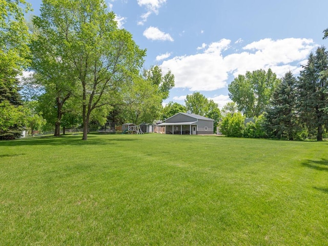 306 Benton St W, Cologne, MN 55322 - view of grassy yard with a playground
