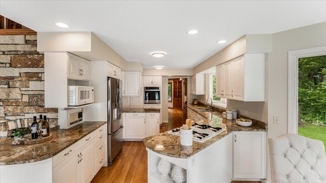 7420 Long Lake Rd, Dovre Twp, MN 56201 - kitchen with stainless steel appliances, open shelves, a sink, plenty of natural light, and recessed lighting