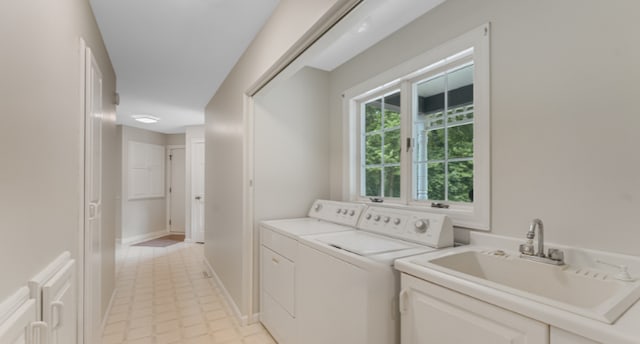 7420 Long Lake Rd, Dovre Twp, MN 56201 - laundry room featuring independent washer and dryer, a sink, and baseboards