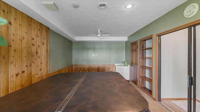7420 Long Lake Rd, Dovre Twp, MN 56201 - unfurnished dining area featuring wooden walls and a ceiling fan