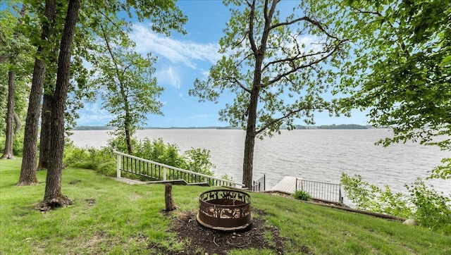 7420 Long Lake Rd, Dovre Twp, MN 56201 - view of green lawn with a water view, an outdoor fire pit, and a boat dock