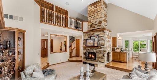 7420 Long Lake Rd, Dovre Twp, MN 56201 - living room featuring high vaulted ceiling and a fireplace