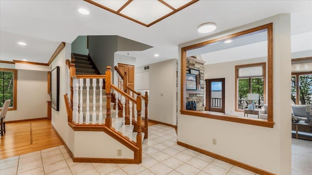7420 Long Lake Rd, Dovre Twp, MN 56201 - stairway featuring baseboards, plenty of natural light, ornamental molding, recessed lighting, and tile patterned flooring