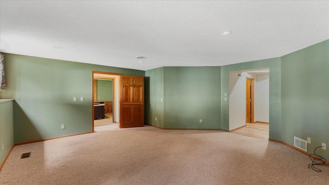 7420 Long Lake Rd, Dovre Twp, MN 56201 - spare room with baseboards, light carpet, a textured ceiling, and recessed lighting