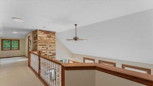 7420 Long Lake Rd, Dovre Twp, MN 56201 - corridor featuring lofted ceiling, baseboards, light colored carpet, and an upstairs landing