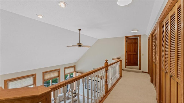 7420 Long Lake Rd, Dovre Twp, MN 56201 - corridor featuring light colored carpet, vaulted ceiling, and an upstairs landing