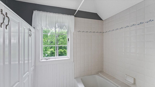 7420 Long Lake Rd, Dovre Twp, MN 56201 - bathroom featuring shower / washtub combination and vaulted ceiling