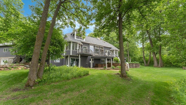7420 Long Lake Rd, Dovre Twp, MN 56201 - back of house featuring a lawn and a wooden deck