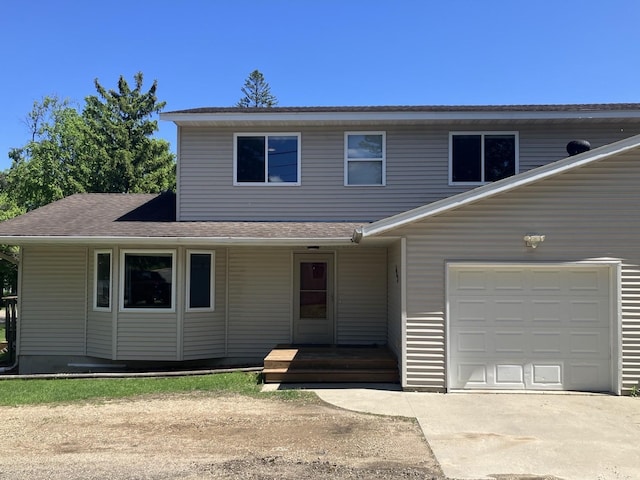 408 Beech Ave, Fergus Falls, MN 56537 - view of front of house featuring driveway, a porch, an attached garage, and a shingled roof