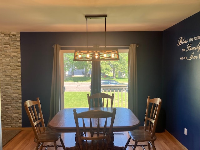 408 Beech Ave, Fergus Falls, MN 56537 - dining room with plenty of natural light, a chandelier, and wood finished floors