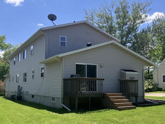 408 Beech Ave, Fergus Falls, MN 56537 - back of property featuring a lawn, a deck, and central air condition unit