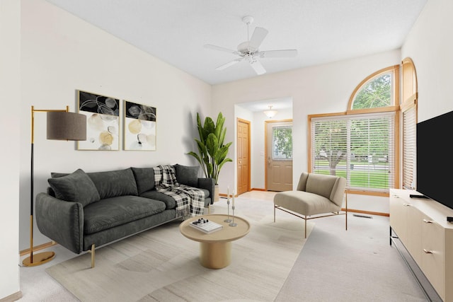 10767 Tamarack Cir NW, Coon Rapids, MN 55433 - living room with a ceiling fan and light colored carpet