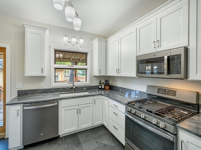 1396 Palace Ave, Saint Paul, MN 55105 - kitchen with stainless steel appliances, a sink, white cabinets, and dark stone countertops