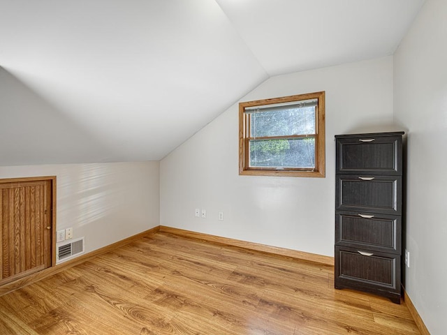 1396 Palace Ave, Saint Paul, MN 55105 - additional living space with lofted ceiling, light wood-style flooring, and baseboards