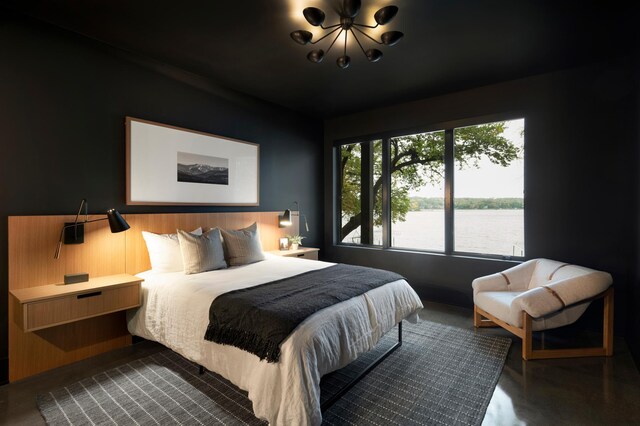 5283 Frost Point Cir SE, Prior Lake, MN 55372 - bedroom with a chandelier and a water view