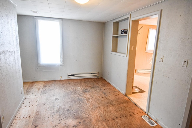 715 8th St E, Thief River Falls, MN 56701 - spare room with baseboard heating and baseboards
