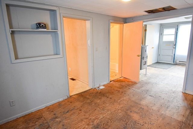 715 8th St E, Thief River Falls, MN 56701 - unfurnished bedroom with baseboard heating and baseboards