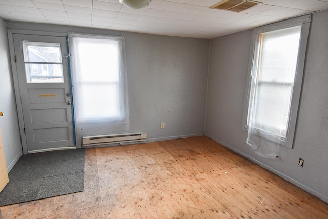 715 8th St E, Thief River Falls, MN 56701 - entryway featuring a baseboard heating unit and baseboards