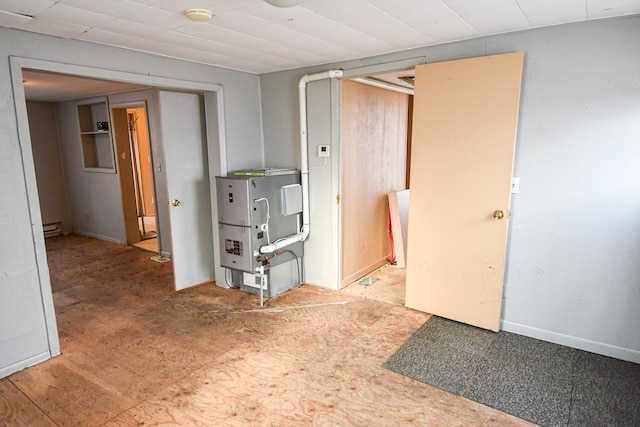 715 8th St E, Thief River Falls, MN 56701 - spare room featuring a baseboard radiator and a smoke detector